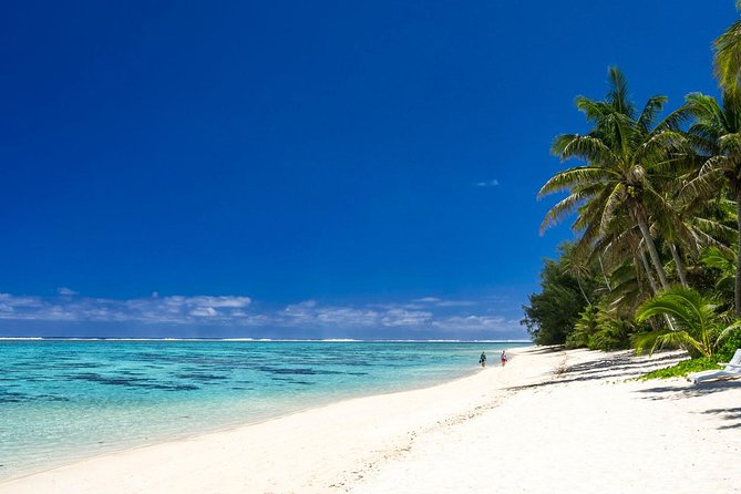 Seat in Coach Transfer from Rarotonga Airport to Hotel - A flower ei welcome after customs