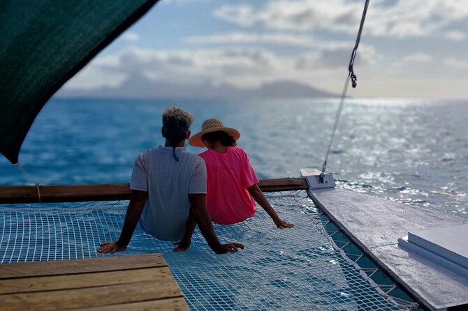 Sunset sailing trip on the Lagoon of Tahiti - Moorea provides the evening backdrop